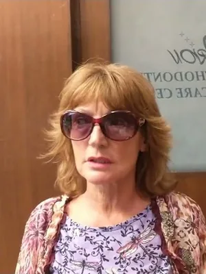 A patient speaking to camera about their treatment at Orion Dental Clinic