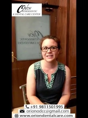 A patient speaking to camera about their treatment at Orion Dental Clinic